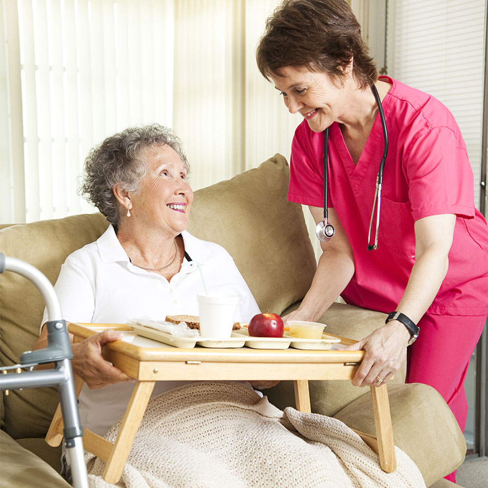 nurse feeding patient